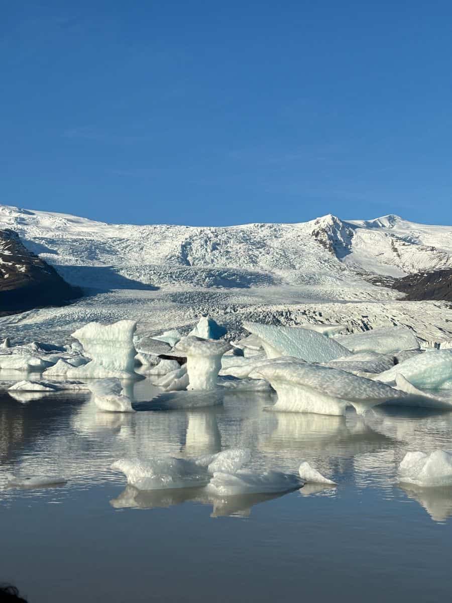 Icebergs floating in a lagoon after breaking off from a glacier in Iceland