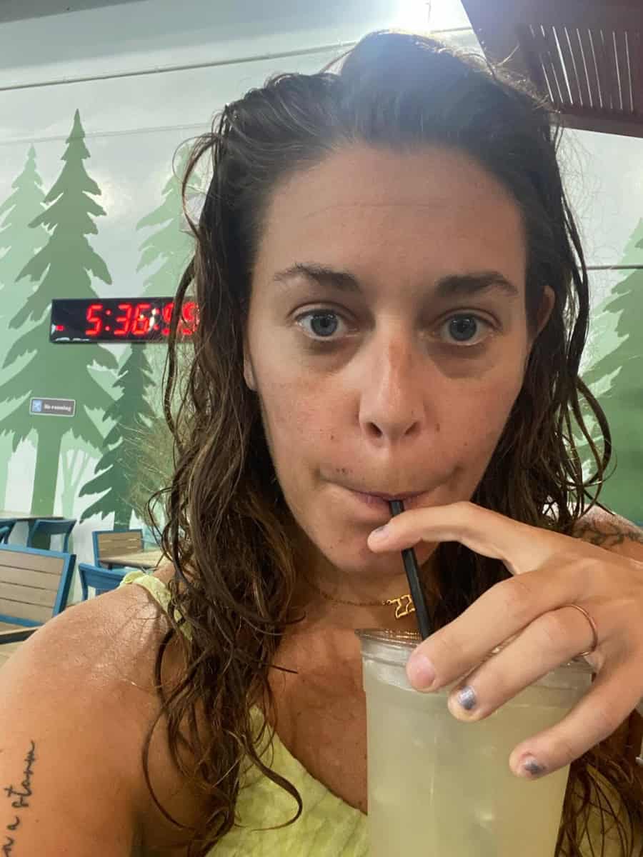 A mom at Great Wolf Lodge waterpark sipping a cocktail