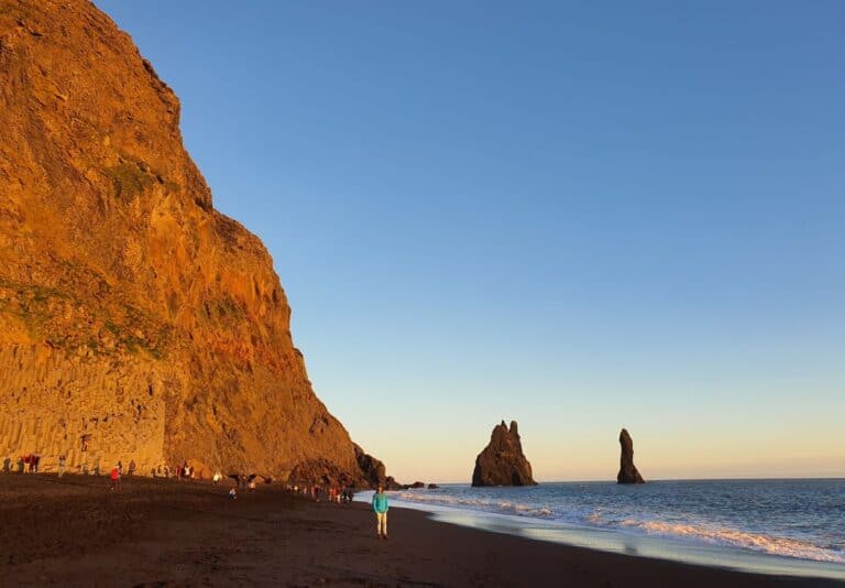 A view of the black sand beach in Iceland at sunset