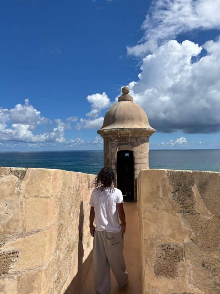 A teen walking onto a garita in Castillo San Felipe del Morro