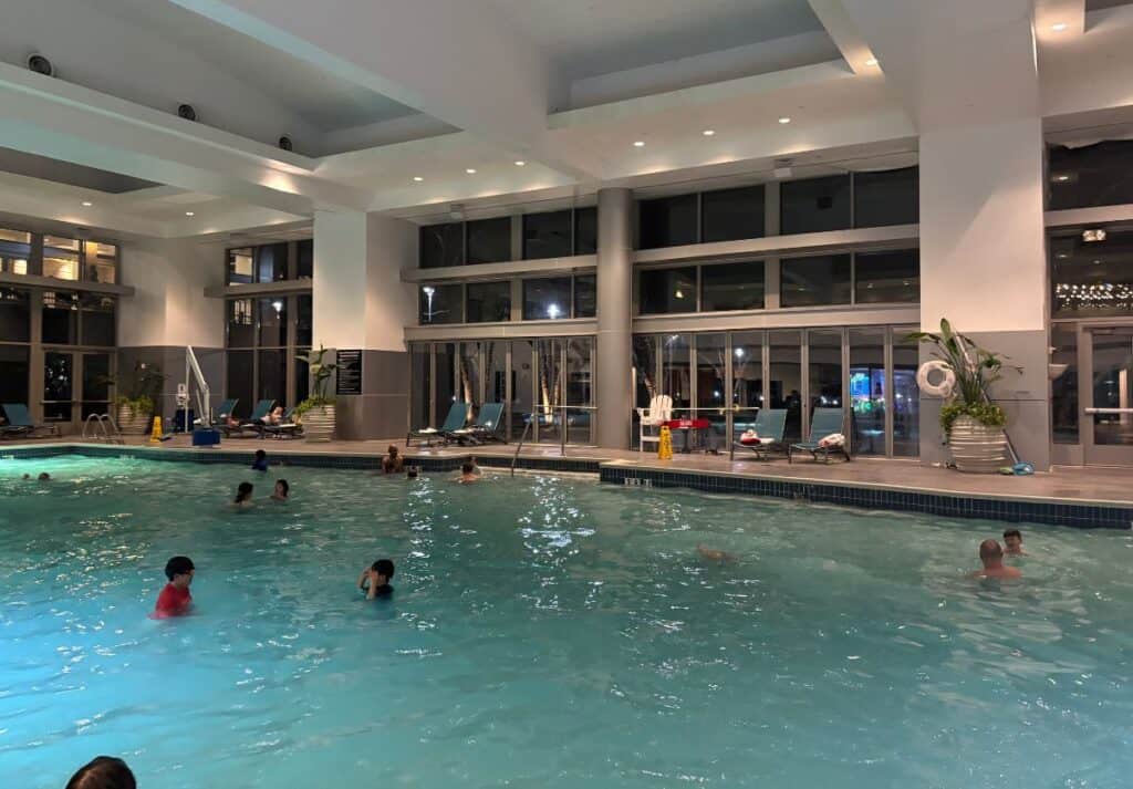 Families with teens enjoying the Gaylord National Harbor's Indoor Swimming Pool 