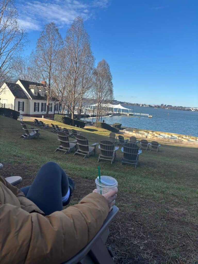 POV of a teen sitting on a chair on a hill with a view of the Potomac from the grounds of the Gaylord. With 