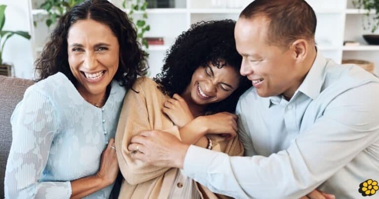 Parents and teenager playing the 21 Questions game together.