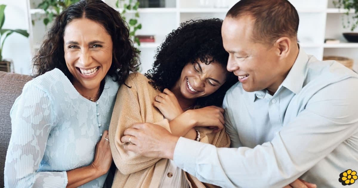 Parents and teenager playing the 21 Questions game together.